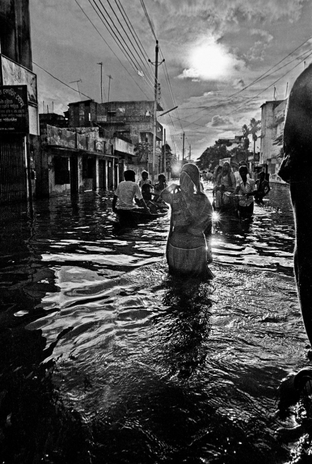 Woman Wading in Flood